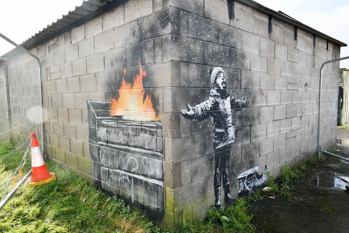 <br><br>Banksy painting walls